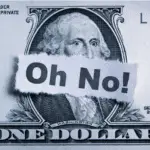 Dollar bill with the word 'oh no' on it - demonstrating the mistakes people make when filing taxes